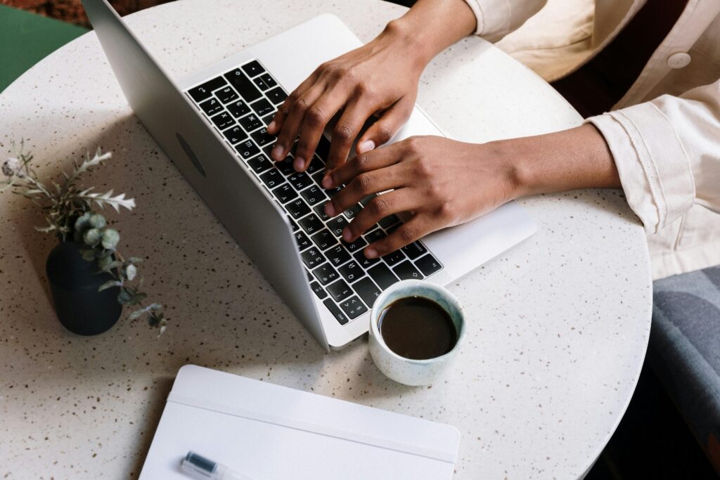 Massive Passive Profits-someone typing on a computer keyboard